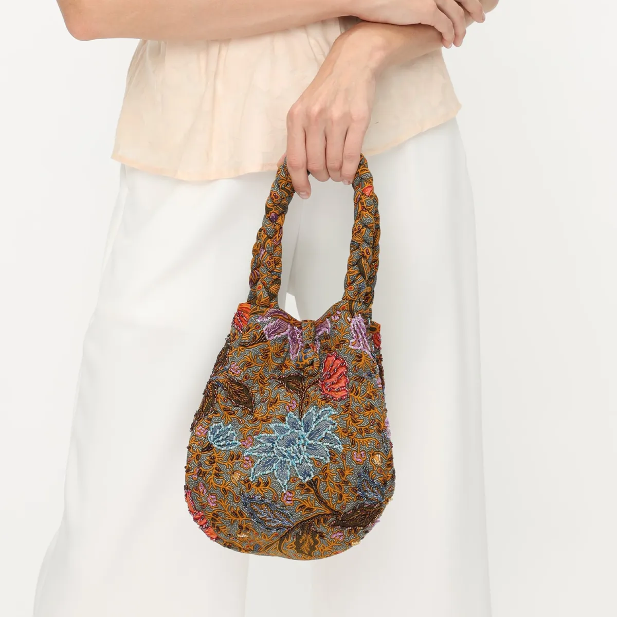 Beaded Blossom bag: floral batik pattern in warm browns and blues, with braided handles